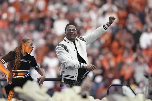 Entertainer Nelly performs at halftime of the Big 12 Conference championship NCAA college football game between Oklahoma State and Texas in Arlington, Texas, Saturday, Dec. 2, 2023. (AP Photo/Tony Gutierrez, File)