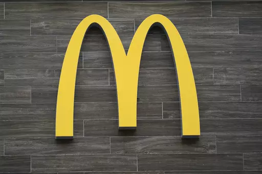 A McDonald's logo hangs outside of a location in Havertown, Pa., on April 26, 2022. A McDonald's franchise that controls 12 restaurants in metro New Orleans violated child labor laws affecting more than 70 minors, the U.S. Department of Labor said Tuesday, July 25, 2023. The division also found similar violations at four McDonald's locations operated in Texas. (AP Photo/Matt Rourke, File)