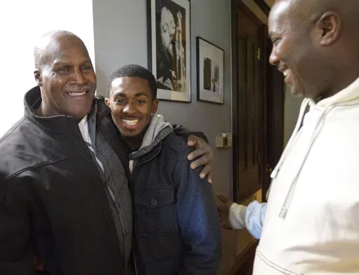 Malcolm Alexander, left, 58, was roughly the same age as his grandson son Malcolm Stewart, Jr., 20, center, next to his son Malcolm Stewart before a press conference shortly after his release in New Orleans, La., on Jan. 30, 2018. Alexander, a Louisiana man imprisoned for nearly four decades until conviction in a 1979 rape was thrown out in 2018, is now fighting for compensation for being wrongfully convicted. The Times-Picayune/The New Orleans Advocate reports that attorneys for Alexander took 