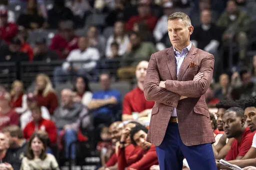 Alabama head coach Nate Oats tracks his team during the first half of an NCAA college basketball game against Davidson, Tuesday, Dec. 21, 2021, in Birmingham, Ala. (AP Photo/Vasha Hunt)
