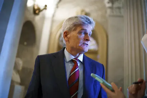Sen. Bill Cassidy, R-La., pauses outside the chamber during a confirmation vote, at the Capitol in Washington, Oct. 5, 2021. Both of the state's U.S. senators, Cassidy and Sen. John Kennedy say they have mulled over the option of running for governor and plan on announcing their decisions for 2023. (AP Photo/J. Scott Applewhite, File)