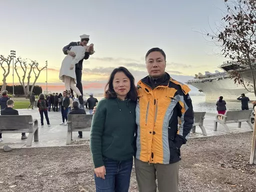 This undated handout photo released by Safeguard Defenders shows Chinese dissident Liu Sifang and his wife Lu Lina in the United States. When her husband fled China in 2019 to escape a police crackdown on dissidents, Lu Lina thought she and their young son could soon join him in safety abroad. She did not know that she would be forced to move house, that her 8-year-old son would be effectively kicked out of school and that border police would block her from leaving the country over the next thre