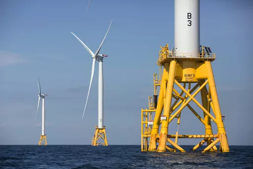 Three wind turbines stand in the water off Block Island, R.I, the nation's first offshore wind farm, Aug. 15, 2016. The first auction of offshore leases for wind power development in the Gulf of Mexico off the Louisiana and Texas coasts will be held Tuesday, Aug. 29, 2023, the Biden administration announced Thursday, July 20. (AP Photo/Michael Dwyer, File)
