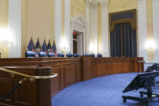 Television crews and technicians prepare the Cannon Caucus Room for Thursday night's hearing by the House select committee investigating the attack of Jan. 6, 2021, at the Capitol in Washington, June 7, 2022. Members of the House committee investigating the events of Jan. 6 will hold their first prime time hearing Thursday, June 9, 2022, to share what they have uncovered. (AP Photo/J. Scott Applewhite, File)