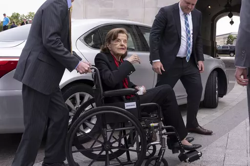 Sen. Dianne Feinstein, D-Calif., is assisted to a wheelchair by staff as she returns to the Senate after a more than two-month absence, at the Capitol in Washington, Wednesday, May 10, 2023. Feinstein's ongoing medical struggles have raised a sensitive political question with no easy answer: Who would California Democratic Gov. Gavin Newsom pick to replace her if the seat became vacant? (AP Photo/J. Scott Applewhite, File)