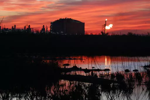 A flare burns at Venture Global LNG in Cameron, La., on Friday, April 21, 2022. The new facility, which exports liquefied natural gas, is one of several like it along the Gulf Coast — and there are proposals for several more in Louisiana and Texas. Natural gas from the Permian Basin in Texas and other areas is sent by pipeline to the export facilities. It is then cooled and liquefied, making it possible to send much greater quantities by ship to Asia, Europe and other places that are hungry fo