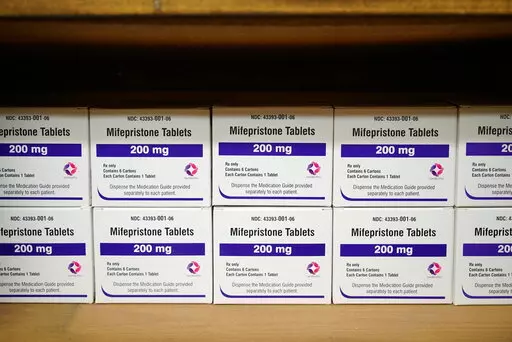 Boxes of the drug mifepristone line a shelf at the West Alabama Women's Center in Tuscaloosa, Ala., on Wednesday, March 16, 2022. The drug is one of two used together in "medication abortions."   On Friday, June 17,  The Associated Press reported on stories circulating online incorrectly claiming medication abortions are dangerous.  (AP Photo/Allen G. Breed, File)