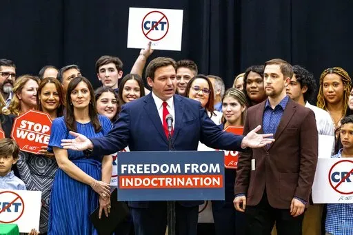 Florida Gov. Ron DeSantis addresses the crowd before publicly signing HB7, "individual freedom," also dubbed the "Stop Woke" bill during a news conference at Mater Academy Charter Middle/High School in Hialeah Gardens, Fla., on Friday, April 22, 2022. As Republicans and Democrats fight for control of Congress this fall, a growing collection of conservative political action groups is targeting its efforts closer to home: at local school boards. DeSantis endorsed a slate of school board candidates