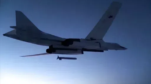 In this photo taken from a video distributed by Russian Defense Ministry Press Service, on Dec. 9, 2020, a Russian Tu-160 strategic bomber fires a cruise missile at test targets, during a military drills, Russia. The Russian Defense Ministry said that the military will hold drills involving tactical nuclear weapons – the first time such exercise was publicly announced by Moscow. (Russian Defense Ministry Press Service via AP, File)