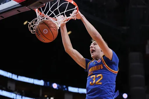 East forward Cooper Flagg dunks on a fast break during the third quarter of the McDonald's All American boys' basketball game Tuesday, April 2, 2024, in Houston. The incoming Duke freshman is among the potential headliners for the 2025 NBA draft.(AP Photo/Kevin M. Cox)