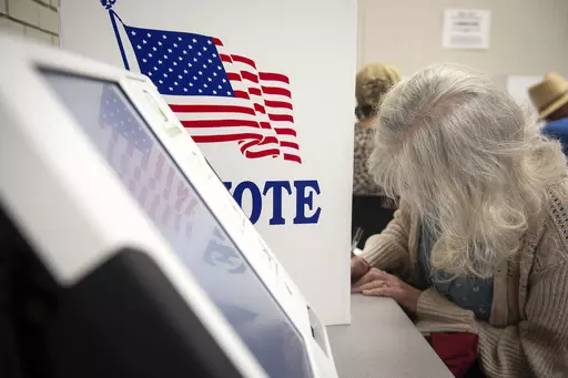 Voters fill in their ballots at at Precinct 5 at Wood Activity & Therapeutic Center in Clinton, Miss., during the general election, Nov. 7, 2023. Since most Americans last voted for Congress, thousands of people have been added to certain voting districts — and subtracted from others — under new political maps enacted following court rulings. (Barbara Gauntt/The Clarion-Ledger via AP, file)