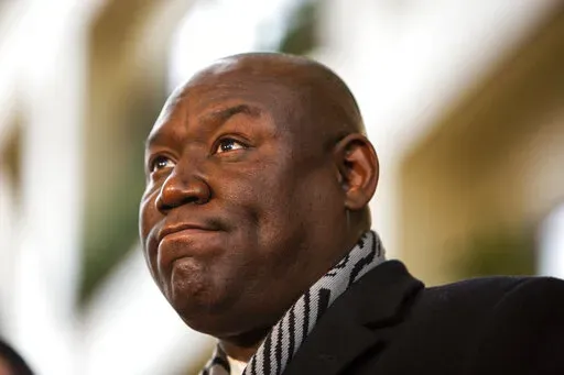 Attorney Ben Crump reacts after former Brooklyn Center Police Officer Kim Potter was sentenced to two years in prison, Friday, Feb. 18, 2022 in Minneapolis. Potter was convicted in December of both first-degree and second-degree manslaughter in the April 11 killing of Wright, a 20-year-old Black motorist. (AP Photo/Nicole Neri )