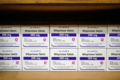 Boxes of the drug mifepristone line a shelf at the West Alabama Women's Center in Tuscaloosa, Ala., on Wednesday, March 16, 2022. The drug is one of two used together in "medication abortions." According to Planned Parenthood, mifepristone blocks progesterone, stopping a pregnancy from progressing. (AP Photo/Allen G. Breed)