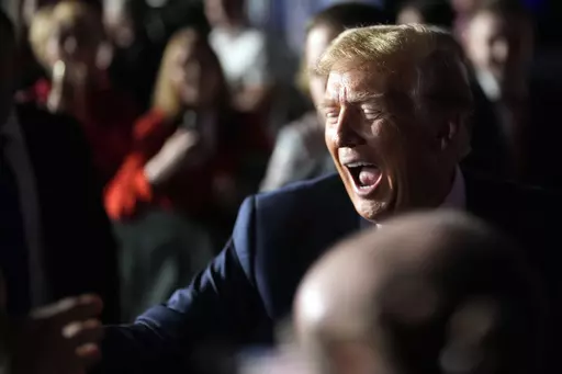 Republican presidential candidate former President Donald Trump greets people after a Fox News Channel town hall Tuesday, Feb. 20, 2024, in Greenville, S.C. (AP Photo/Chris Carlson)