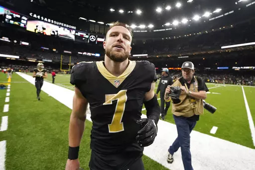 New Orleans Saints' Taysom Hill leaves the field after the team's 39-32 win over the Seattle Seahawks in an NFL football game in New Orleans, Sunday, Oct. 9, 2022. (AP Photo/Gerald Herbert)