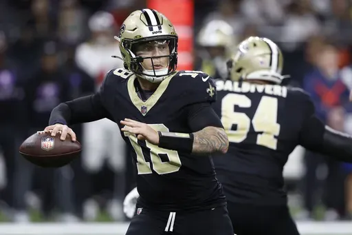 New Orleans Saints quarterback Spencer Rattler passes against the Tampa Bay Buccaneers during the second half of an NFL football game in New Orleans, Sunday, Oct. 13, 2024. (AP Photo/Butch Dill)
