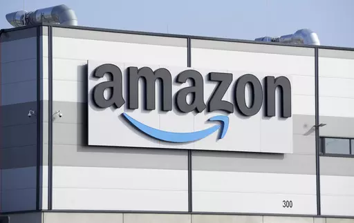 An Amazon company logo marks the facade of a building, March 18, 2022, in Schoenefeld near Berlin. Companies make it easy to subscribe to their services — and frustratingly hard to unsubscribe. In June, the Federal Trade Commission filed a complaint alleging Amazon duped people into signing up for Amazon Prime subscriptions and then designed a “labyrinthine” cancellation process. (AP Photo/Michael Sohn, File)