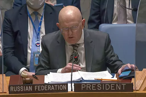 In this image from UNTV video, Vasily Nebenzya, Permanent Representative of Russia to the United Nations, speaks during an emergency meeting of the U.N. Security Council Wednesday, Feb. 23, 2022, at U.N. headquarters. (UNTV via AP)