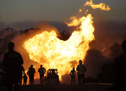 In this Sept. 9, 2010, photo, a massive fire roars through a neighborhood in San Bruno, Calif. U.S. officials on Monday, March 28, 2022, adopted a long- delayed rule aimed at reducing deaths and environmental damage from oil and gas pipeline accidents. (AP Photo/Paul Sakuma, File)