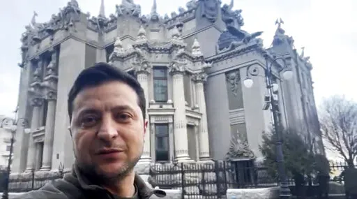 In this photo provided by the Ukrainian Presidential Press Office, Ukrainian President Volodymyr Zelenskyy speaks to the nation via his smartphone in the center of Kyiv, Ukraine, Saturday, Feb. 26, 2022.  Russian troops stormed toward Ukraine’s capital Saturday, and street fighting broke out as city officials urged residents to take shelter. The country's president refused an American offer to evacuate, insisting that he would stay. “The fight is here,” he said. (Ukrainian Presidential Pre
