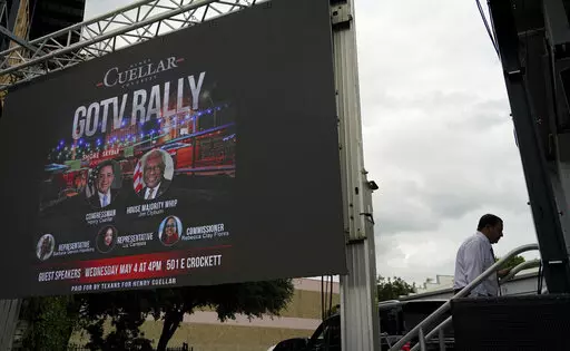 U.S. Rep. Henry Cuellar, D-Laredo, walks to the stage during a campaign event, Wednesday, May 4, 2022, in San Antonio. Cuellar, a 17-year incumbent and one of the last anti-abortion Democrats in Congress, is in his toughest reelection campaign, facing a May 24 primary runoff against progressive Jessica Cisneros. (AP Photo/Eric Gay)