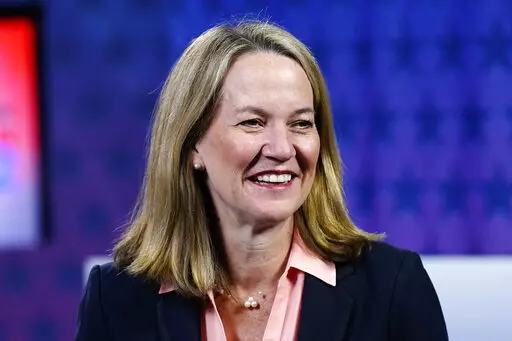 Kris Mayes, a Democratic candidate for Arizona attorney general, smiles before a debate against Republican Abraham Hamadeh on Sept. 28, 2022. On Friday, Dec. 23, 2022, a judge threw out Hamadeh's challenge of election results in the race and concluded Hamadeh didn't prove the errors in vote counting that he had alleged. Mayes finished 511 votes ahead of Hamadeh out of 2.5 million in one of the closest elections in state history. (AP Photo/Ross D. Franklin, File)