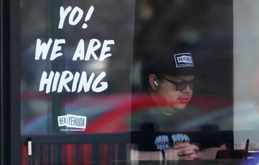 A hiring sign is displayed at a restaurant in Schaumburg, Ill., Friday, April 1, 2022. More Americans applied for unemployment benefits last week, and while layoffs remain low, it's the fifth straight week claims have topped the 230,000 mark. Applications for jobless aid for the week ending July 2 rose to 235,000, up 4,000 from the previous week, the Labor Department reported Thursday, July 7. (AP Photo/Nam Y. Huh, File)