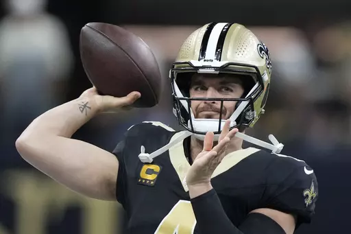 New Orleans Saints quarterback Derek Carr (4) throws a pass during warmups ahead of an NFL football game against the Tampa Bay Buccaneers, in New Orleans, Sunday, Oct. 1, 2023. (AP Photo/Gerald Herbert)