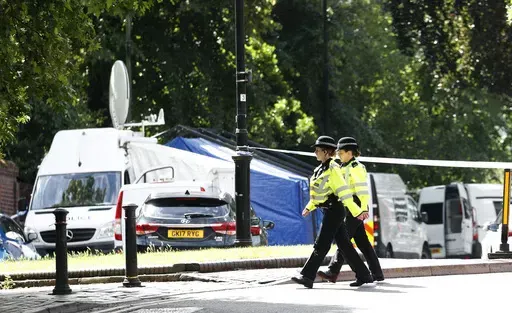 Police patrol outside Forbury Gardens, a day after a multiple stabbing attack in the gardens in Reading, England, Sunday June 21, 2020. Knife crimes are on the rise in England and Wales, and a string of deadly attacks in recent years has stoked public anxiety and led to calls for the government to do more. (AP Photo/Alastair Grant, File)