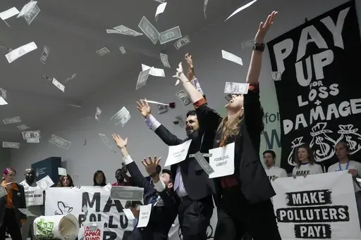 Activists participate in a demonstration for climate finance at the COP29 U.N. Climate Summit, Thursday, Nov. 21, 2024, in Baku, Azerbaijan. (AP Photo/Sergei Grits)