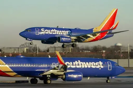 Southwest Airlines plane prepares to land at Midway International Airport, Feb. 12, 2023, in Chicago. Southwest Airlines is back in court over firing a flight attendant with anti-abortion views. (AP Photo/Kiichiro Sato, File)