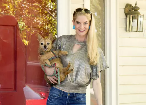 This May 2020 photo shows Tracy Smith in Tulsa, Okla. Smith has been using the mating site Modamily to find a platonic co-parent. (Jenny White Photography via AP)