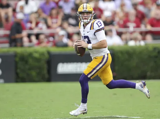 LSU quarterback Garrett Nussmeier (13) rolls out of the pocket during the second half of an NCAA college football game against South Carolina, Saturday, Sept. 14, 2024 in Columbia, S.C. (AP Photo/Artie Walker Jr.)