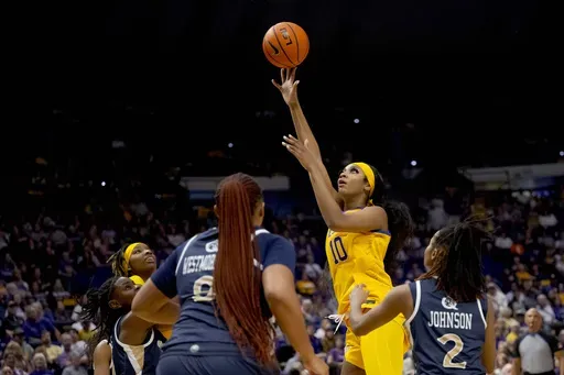 LSU forward Angel Reese (10) shoots against Queens guard Alexandria Johnson (2) during the first half of an NCAA college basketball game Thursday, Nov. 9, 2023, in Baton Rouge, La. (AP Photo/Matthew Hinton)