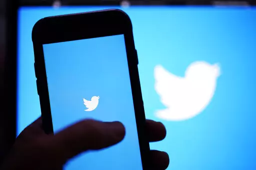 The Twitter application is seen on a digital device, April 25, 2022, in San Diego. Twitter said Tuesday, July 12, 2022, that it has sued Elon Musk to force him to complete the $44 billion acquisition of the social media company. (AP Photo/Gregory Bull, File)