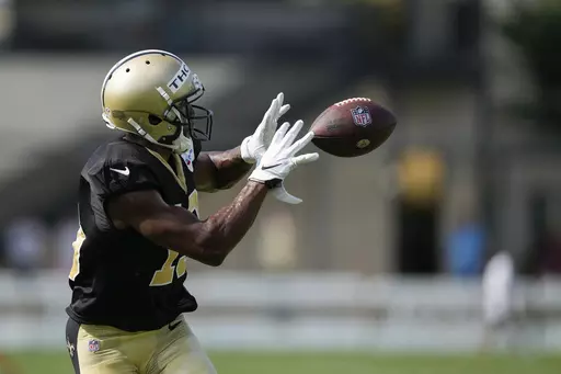 New Orleans Saints wide receiver Michael Thomas catches during drills at the NFL team's football training camp in Metairie, La., Tuesday, Aug. 1, 2023. (AP Photo/Gerald Herbert)