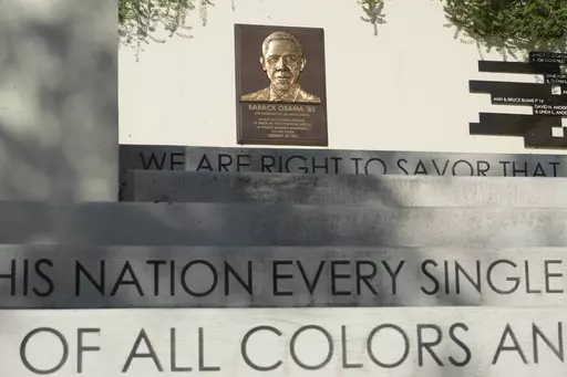Words decorate the concrete steps up to a bronze plate with the likeness of former President Barack Obama at the Plaza where then student Obama made his first political speech "A Protest against Apartheid" on Feb. 18, 1981, at Occidental College in Los Angeles, seen on Thursday, July 27, 2023. Occidental College is the latest school to end legacy admissions in the wake of a Supreme Court decision removing race from admissions decisions. (AP Photo/Damian Dovarganes)