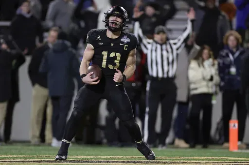 Army quarterback Bryson Daily (13) reacts after scoring a touchdown during the first half of the American Athletic Conference championship NCAA college football game against Tulane Friday, Dec. 6, 2024, in West Point, N.Y. (AP Photo/Adam Hunger)