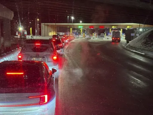 Cars are backed up at the US-Canada border in Stanstead, Quebec, after a shooting involving a U.S. Border Patrol agent in Coventry, Vt., Monday, Jan. 20, 2025. (AP Photo/Chloe Jones)