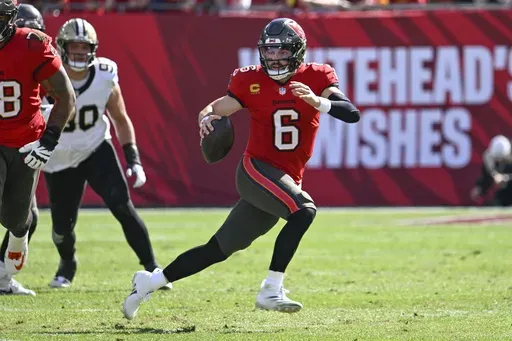 Tampa Bay Buccaneers quarterback Baker Mayfield (6) scrambles during the first half of an NFL football game against the New Orleans Saints Sunday, Jan. 5, 2025, in Tampa, Fla. (AP Photo/Jason Behnken)