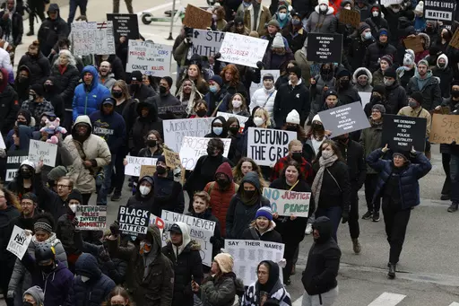 A crowd of over 300 people protest the killing of Patrick Lyoya in Grand Rapids, Mich., April 16, 2022. The 26-year-old Congolese refugee was fatally shot by a Grand Rapids police officer after resisting arrest during a traffic stop on April 4. (Eric Seals /Detroit Free Press via AP)