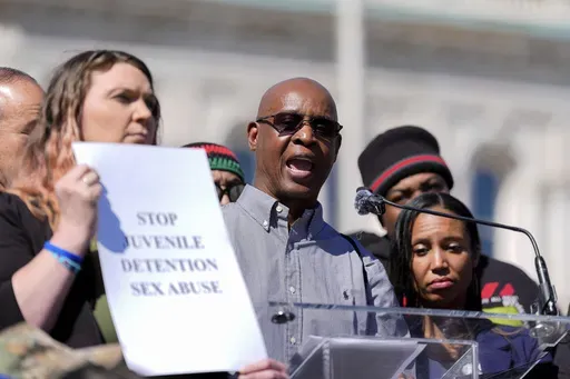 Arlando "Tray" Jones, center, speaks during a press conference among other survivors of sexual abuse in Maryland juvenile detention centers, Wednesday, March 19, 2025, in Baltimore. (AP Photo/Stephanie Scarbrough)