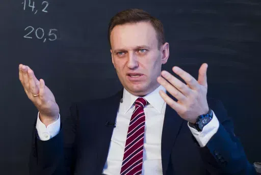 Russian opposition politician Alexei Navalny gestures while speaking during his interview to the Associated Press in Moscow, Russia on Dec. 18, 2017. U.S. intelligence officials have determined that Russian President Vladimir Putin likely didn't order the death of Navalny, the imprisoned opposition leader, in February of 2024. An official says the U.S. intelligence community has found "no smoking gun" that Putin was aware of the timing of Navalny's death or directly ordered it. (AP Photo/Alexand
