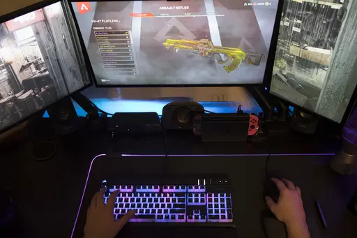 A gamer plays Electronic Arts' "Apex Legends" in Jersey City, N.J., on March 6, 2019. The enthusiasm military personnel have for gaming, and the risk that carries is in the spotlight after Jack Teixeira, a 21-year-old Massachusetts Air National Guardsman, was charged with illegally taking and posting highly classified material on Discord, a social media platform that started as a hangout for gamers. Online gaming forums have long been a particular worry of the military because of their lure for 