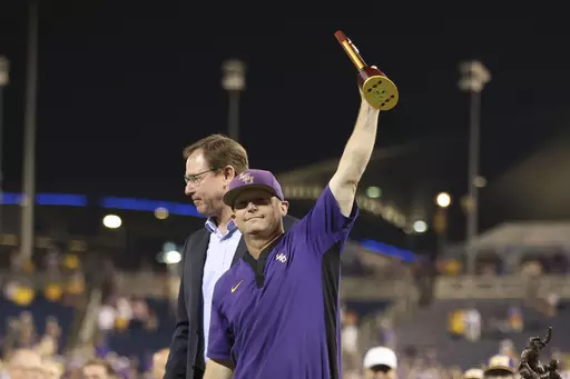 LSU head coach Jay Johnson celebrates their victory over Florida in Game 3 of the NCAA College World Series baseball finals in Omaha, Neb., Monday, June 26, 2023. LSU won the national championship 18-4. (AP Photo/Rebecca S. Gratz)