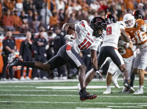 Texas Tech wide reciever Drae McCray (10) runs the ball during the first half of the team's NCAA college football game against Texas, Friday, Nov. 24, 2023, in Austin, Texas. (AP Photo/Michael Thomas)