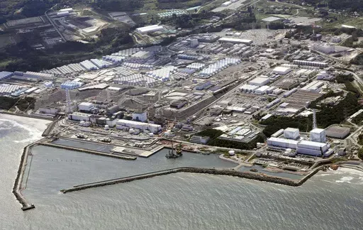 This aerial view shows the Fukushima Daiichi nuclear power plant, situated in coastal towns of both Okuma and Futaba, northeastern Japan, on Aug. 24, 2023, shortly after its operator Tokyo Electric Power Company Holdings TEPCO began releasing its first batch of treated radioactive water into the Pacific Ocean. Japan said Sunday, March 31, 2024, its experts have held talks with their Chinese counterparts to try to assuage Beijing’s concerns over the discharge of treated radioactive wastewater f