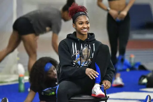 University of Kentucky track & field athlete Masai Russell during practice at the Nutter Field House in Lexington, Ky., Friday, Feb. 18, 2022. Russell is among a cohort of NCAA women's athletes who are making a name for themselves on social media. (AP Photo/Timothy D. Easley)