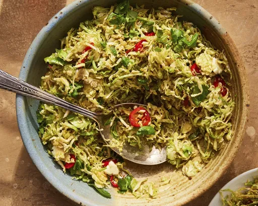 This image released by Milk Street shows a recipe for hot-oil Brussels sprouts with ginger and sesame. (Milk Street via AP)