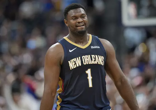 New Orleans Pelicans forward Zion Williamson heads to the bench in the second half of an NBA basketball game against the Denver Nuggets, Monday, Nov. 6, 2023, in Denver. (AP Photo/David Zalubowski)
